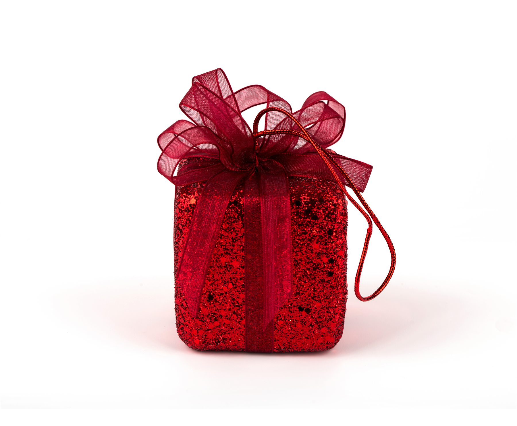 Red gift package with a sheer ribbon bow
